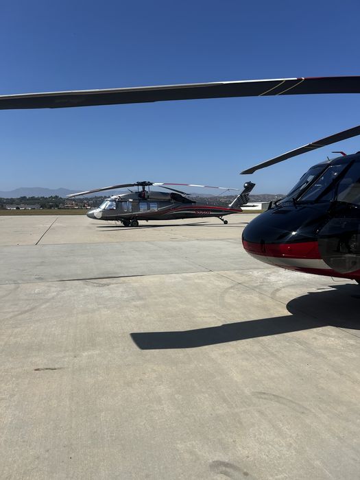 Two helicopters on ramp — Seaview Aviation