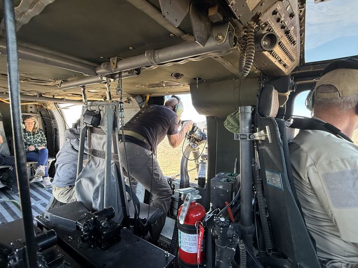 Multiple crew inside Black Hawk cargo area