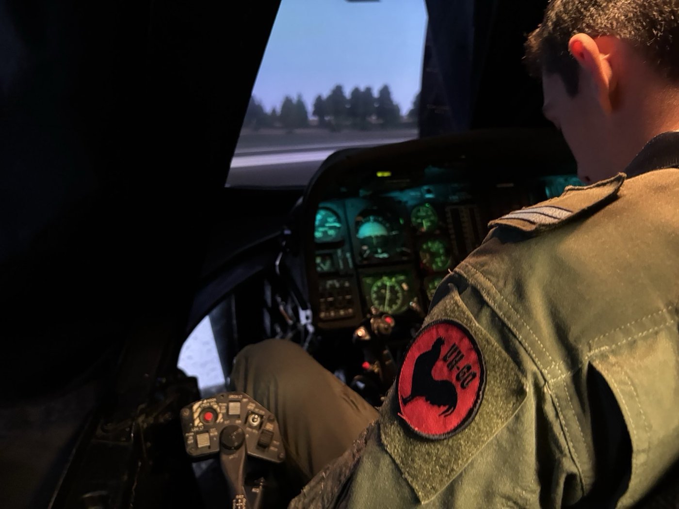 Portugal Air Force pilot in UH-60 simulator — UH-60 patch visible